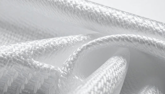 Close-up of woven fiberglass fire blanket fabric showing dense heat-resistant textile structure